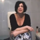 A pretty Italian girl is video-recorded taking a shit. Pooping sounds are audible. She reacts to and comments about the smell, wipes her ass, and shows us the contents of the toilet bowl.
